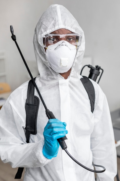 Person disinfecting a restricted area
